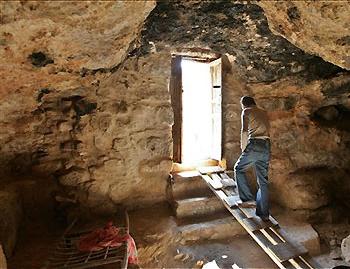 An entrance to the cave underneath St. George\'s Church in Rihab, Jordan