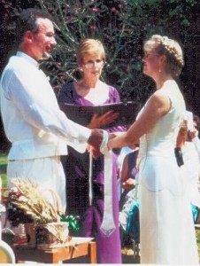 A typical wedding ceremony with handfasting, consisting of tying the hands of the bride and groom together.